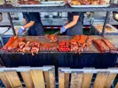 A variety of meats on a large grill
